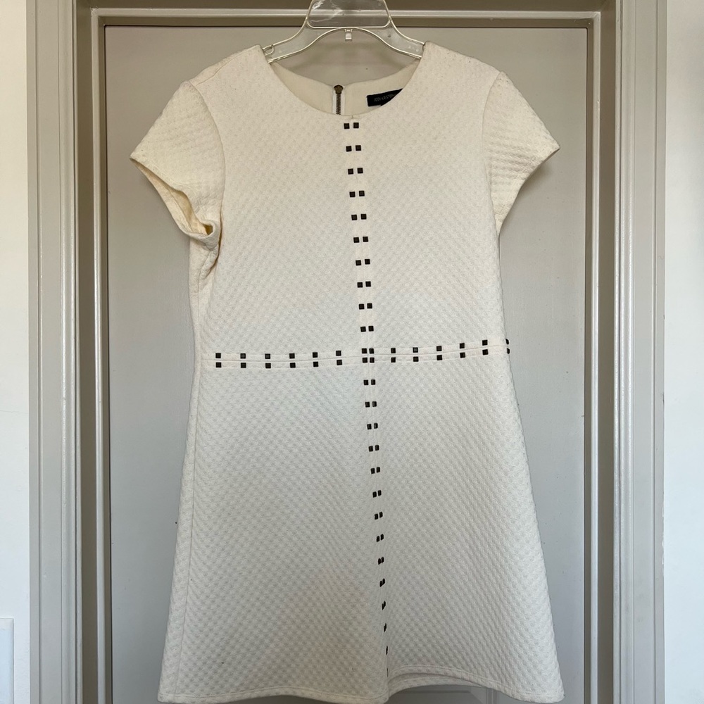 Cream dress with that flares alittle at the bottom